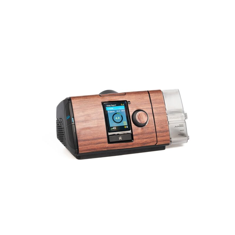 Snugell dark wood grain skin for AirSense 10 CPAP machine, adding a classic and natural look